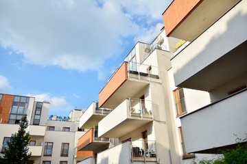 Multistory new modern apartment building. Stylish living block of flats.