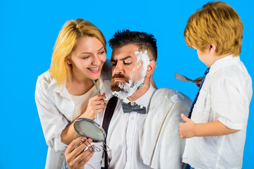 Barbershop. Hair salon. Bearded man. Barber shop tools. Hairdresser making hairstyle. Beard care. Hair preparation. Bearded man in barbershop. Foam for shaving. Barber scissors and razor.