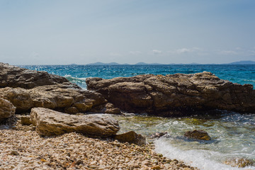 Waves breaking on a stony beach in Murter, Croatia, Dalmatia