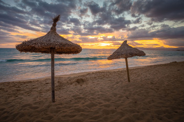 Umbrella on beach. Sunset