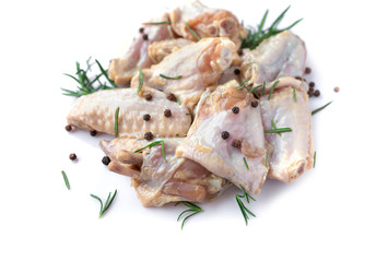 Raw chicken wings with garlic, pepperand rosemary isolated