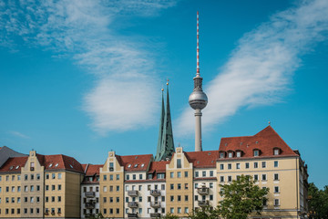 Fototapeta na wymiar Television Tower (Fernsehturm), behind historic district (Nikolaiviertel) in Berlin Germany -