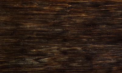 Fototapeta premium Dark brown shabby pine wooden background, aged
