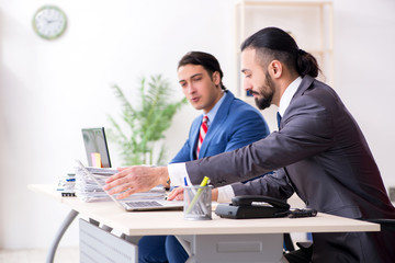 Two male colleagues in the office 