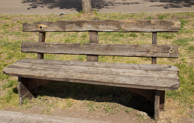 old wooden bench in the city Park