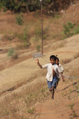 indian child playing with kite