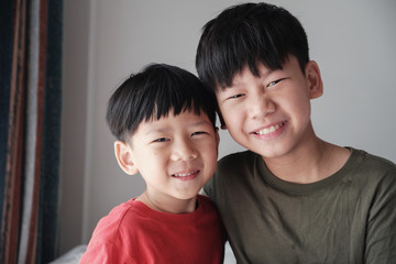 Asian little brother and big brother at home , Happy children portrait