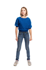Cute teen girl in blue sweater and jeans standing, full length. Isolated on a white background....