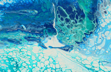 photography of abstract marbleized effect background. Blue, mint and white creative colors. Beautiful paint