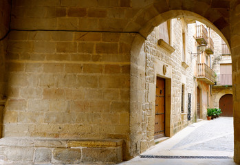 Cozy entrance to the courtyard. Calaceite village, Teruel province, Aragon, Spain