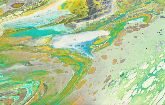 photography of abstract marbleized effect background. yellow, green and white creative colors. Beautiful paint © tomertu