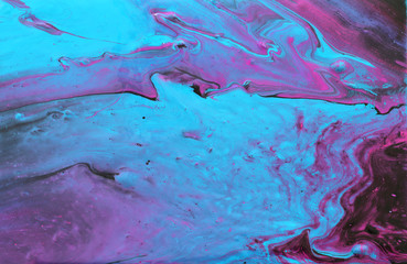 photography of abstract marbleized effect background. Blue, pink, purple and white creative colors. Beautiful paint