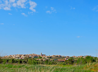 View from far of Cretas village, Aragon, Spain. Thin horizon line and blue sky domination. Landscape background with big place for text 