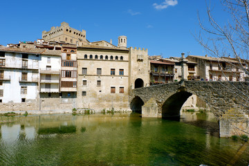 Fototapeta na wymiar View of the river Mataranya, the bridge and the entrance to the city of Valderrobres, province of Teruel, Aragon.