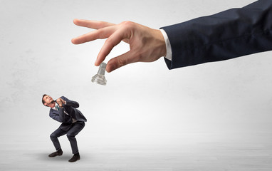 Big hand holding chessman and down little afraid businessman concept in a light space
