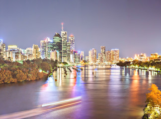 Night cityscape panorama and lights behind a river