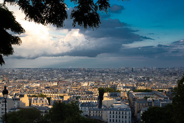 Panoramic View of Paris illuminated by the sun after a thunderstorm. View from Montmartre hill of...