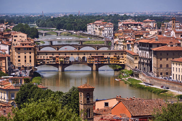 Fototapeta na wymiar Ponte Vecchio - bridge over the Arno river in the city of Florence in Italy.