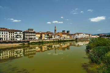 Fototapeta na wymiar Townhouses on the Arno River in the city of Florence in Italy.
