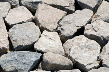 treated large stones prepared for laying pavement