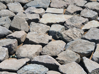 treated large stones prepared for laying pavement