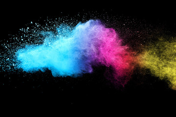 Multi color powder explosion isolated on black background. 