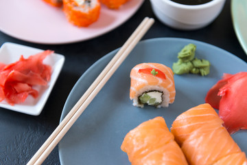 Japanese rolls with salmon on a plate, Japanese cuisine