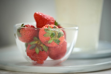 Strawberries in a bowl. Fresh nice strawberries on a white table