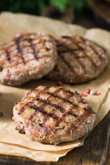 Grilled cutlets on a wooden Board on a wooden table. Rustic style