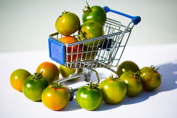 green camone tomatoes in shopping cart