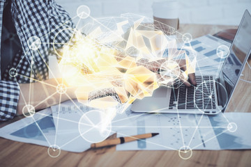 Man typing on keyboard background with brain hologram. Concept of big Data. Double exposure.