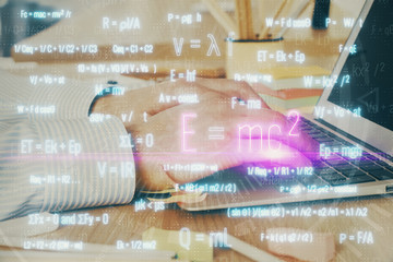 Science formula hologram with man working on computer on background. Education concept. Double...