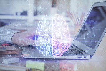 Man typing on keyboard background with brain hologram. Concept of big Data. Double exposure.