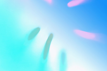 Top view of green tropical leaf shadow in trendy duotone neon background. Flat lay. Minimal summer concept with palm tree leaf. Abstract creative backdrop for modern design. Copy space. Blurred.