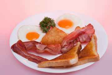 White eggs mixed sausages and breads plate