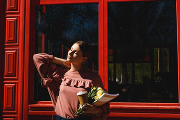 girl near the red facade