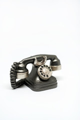 Miniature phone on white background.