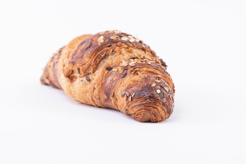 Close-up of a fresh and tasty Croissant with sesame seeds