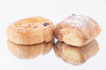 A delicious puff pastry roll and a puff pastry roll