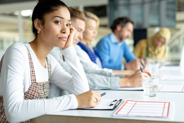 Businesswoman looking away during a business meeting in a modern office 