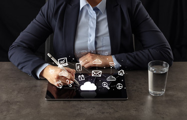 Business woman working on tablet with application and cloud technology concept
