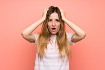 Young woman over isolated pink wall with surprise facial expression