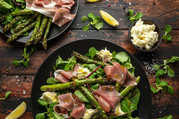 Grilled Asparagus, parma ham salad with mozzarella cheese and green vegetables