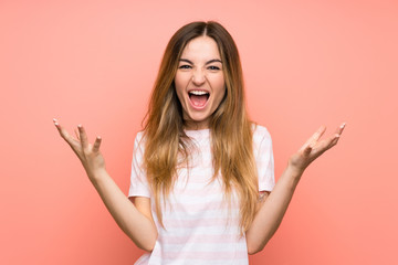 Young woman over isolated pink wall unhappy and frustrated with something