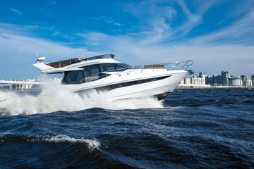 white yacht at river in city, luxury lyfe