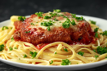 Chicken Parmesan with Cheese and Marinara Sauce served over spaghetti, pasta