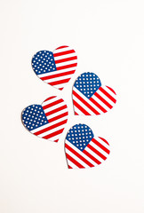 American Independence day background with blue, white and red mixed stars and hearts. Celebration of American independence day, the 4th of July (the Fourth of July). Holiday concept. With copy space. 