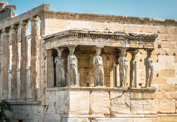 Erechtheion temple with Caryatid Porch on the old Acropolis, Athens, Greece. It is a famous...