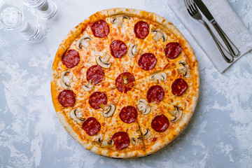 Pepperoni pizza with mushrooms on plate