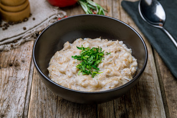 Pearl barley on black bowl